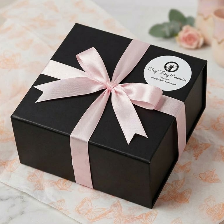 Gift-wrapped Irish pottery in a luxury black box with pink ribbon for international tracked shipping