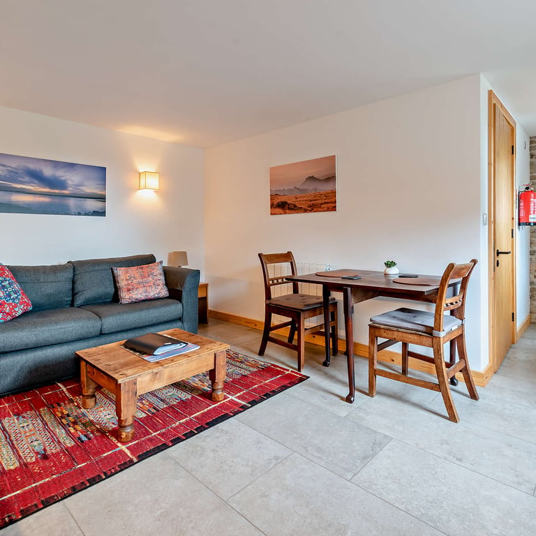 A combined lounge kitchen and dining space is provided in your dog friendly holiday cottage.