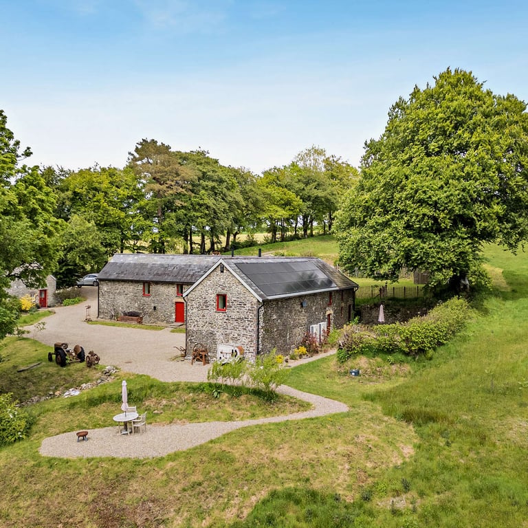 Your dog friendly cottage has a separate seating area with fire pit looking out over the quiet valley.