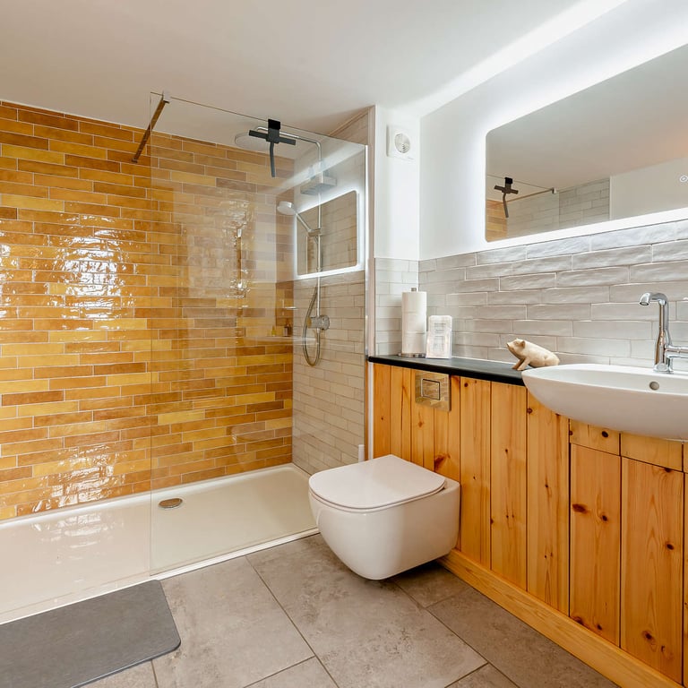 A deluge shower delivers piping hot water for relaxing breaks for couples in this luxurious shower room.
