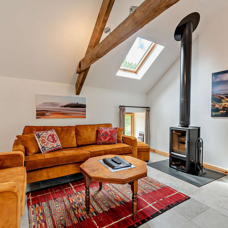 Your holiday cottage is fully equipped with a log burner and comfy seating.