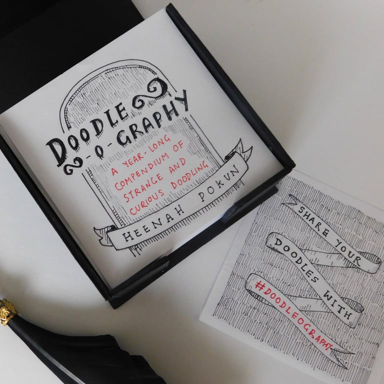a photo of a memo block with gothic style doodles on it and a title called 'Doodle-o-Graphy'
