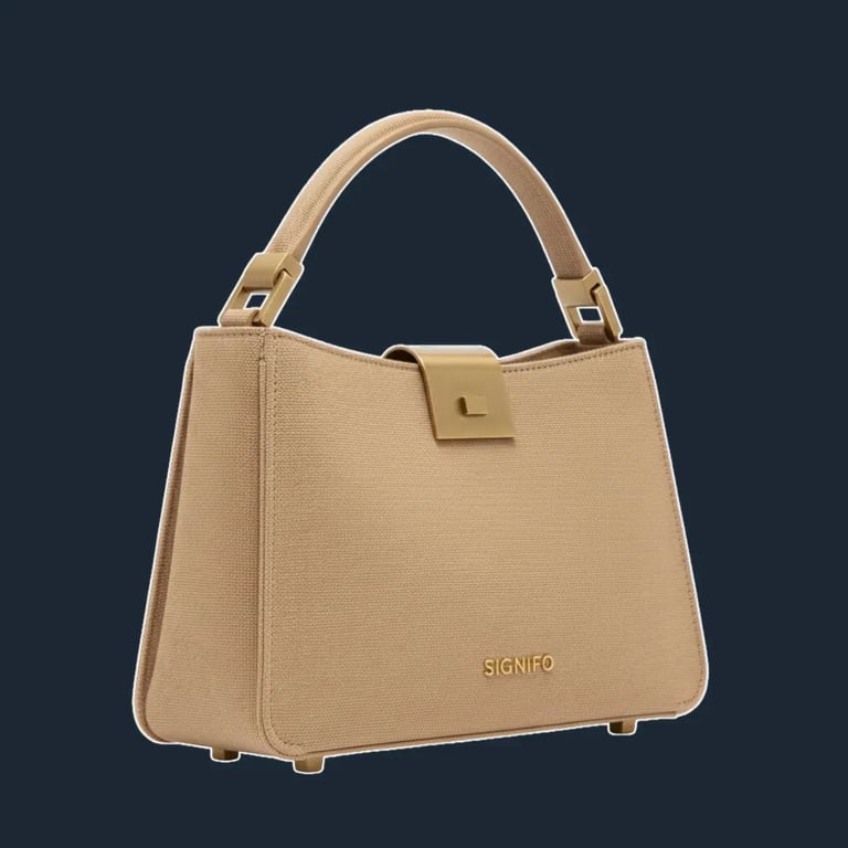 Tas jinjing "Dune Whisper" Signifo kanvas Camel Cream dengan penutup emas.