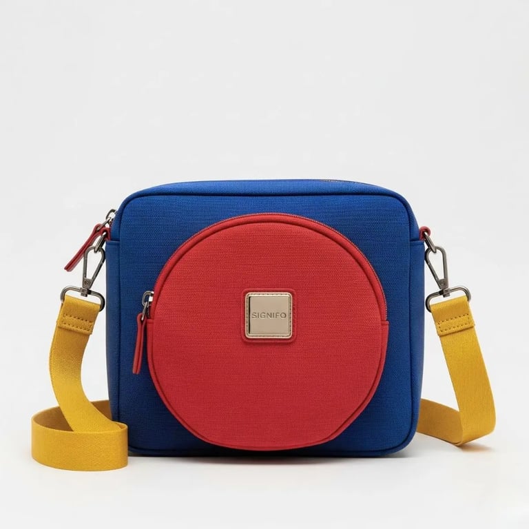 Tas selempang SIGNIFO berwarna biru dengan kantong lingkaran berwarna merah di tengahnya.