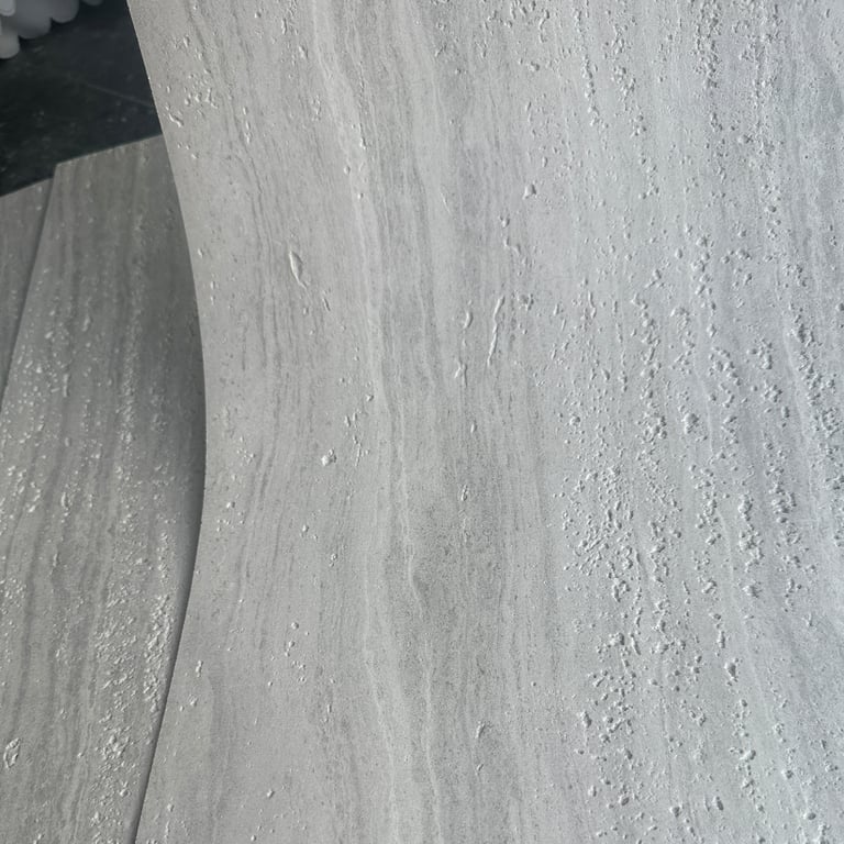 Detailed view of Maya Travertine soft stone with 3D-printed patterns and ultra-thin design.