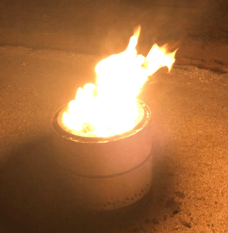 a smokeless fire pit with a fire in the middle of it