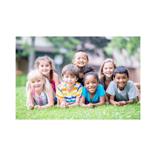 Happy group of school aged children in a park