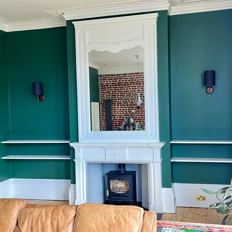 Professional interior painting in Brighton featuring a fireplace with smooth walls and finish