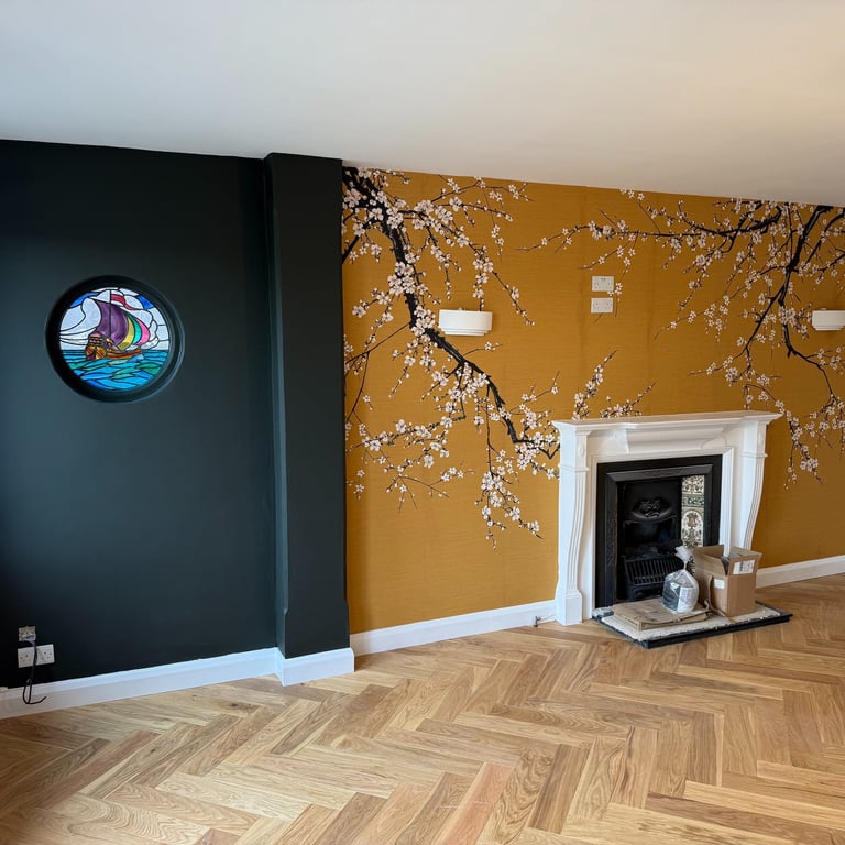Wood flooring installation in a Brighton living room with fireplace