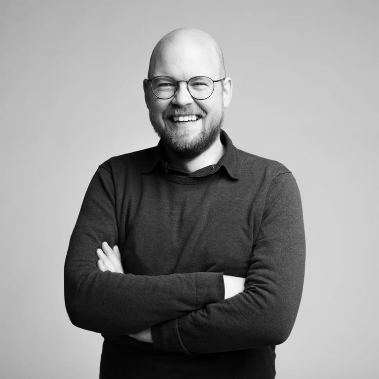 a man with a beard and glasses on his face