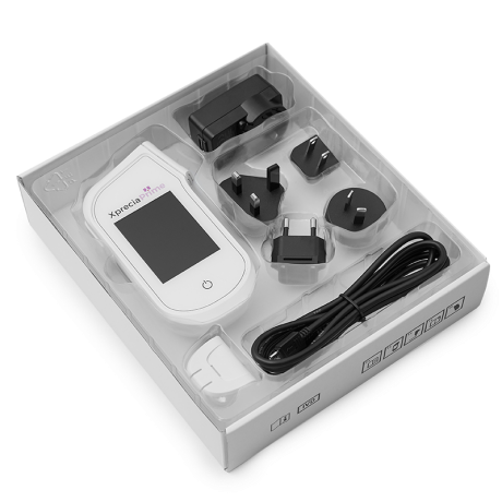 a poct pt inr meter with a white box and a charger