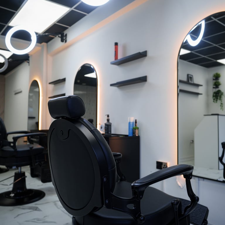 Inside of empty clean and new barbershop, chairs mirrors and LED accent lights