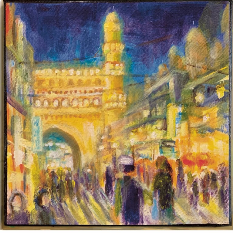 Brightly lit shops next to Charminar at Hyderabad with crowds of shoppers