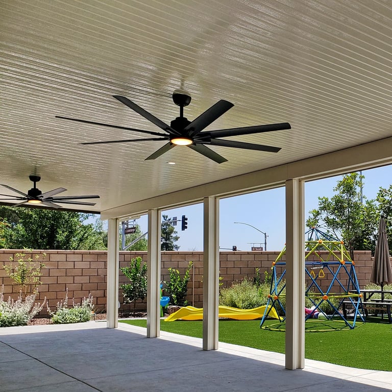Solid Alumawood patio cover with two ceiling fans in Menifee, CA