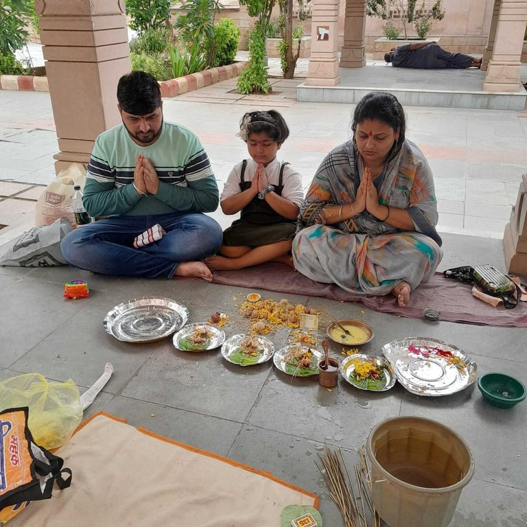A young family participating in the Matrugaya Pooja at Siddhpur