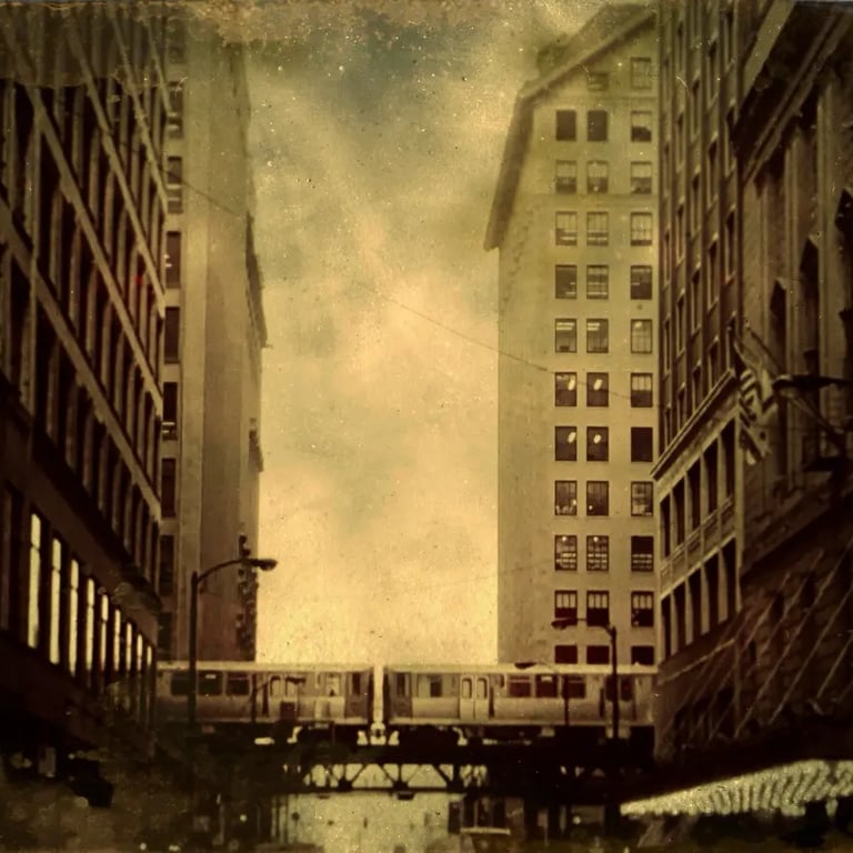 An old fashioned city street in Chicago, showcasing a train on its tracks