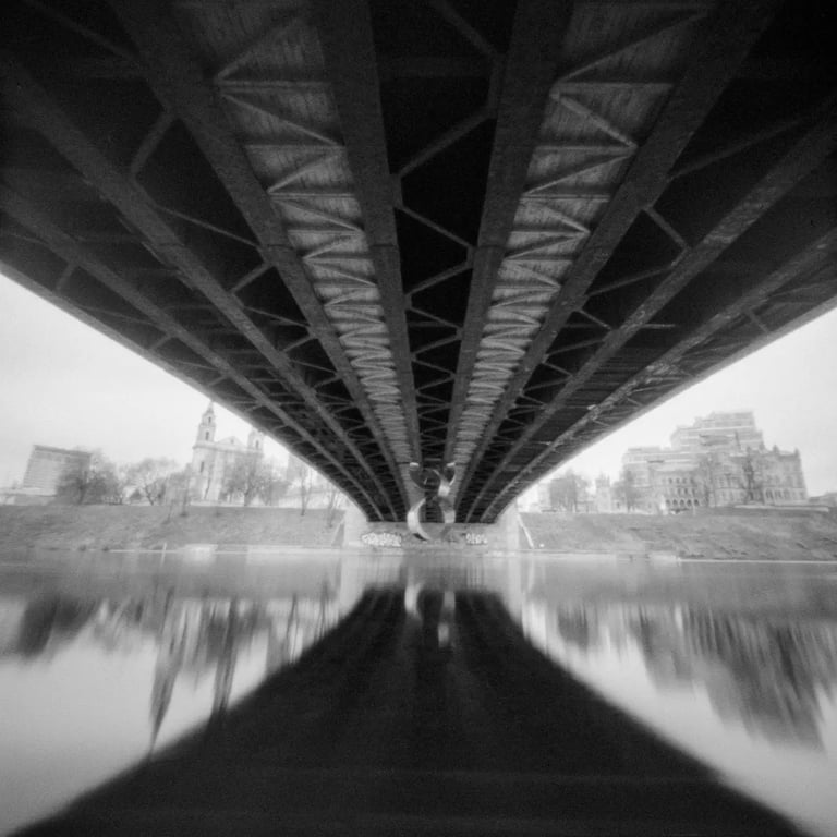 River crossing with black and white bridge