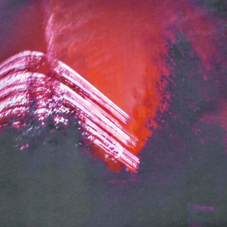 A vibrant red and purple building captured in a photo, standing out against the backdrop of the sun's path over six months