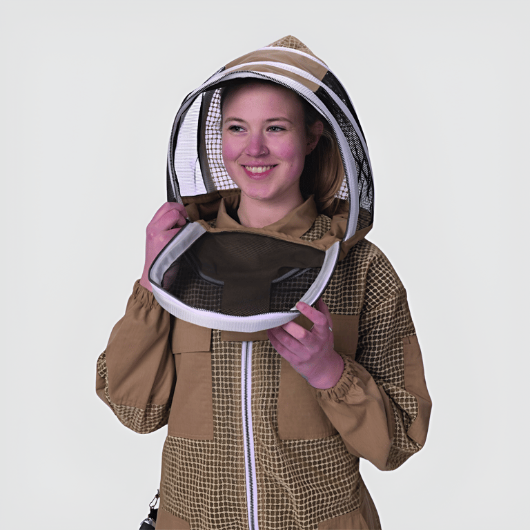 a woman in a bee suit with a beehive