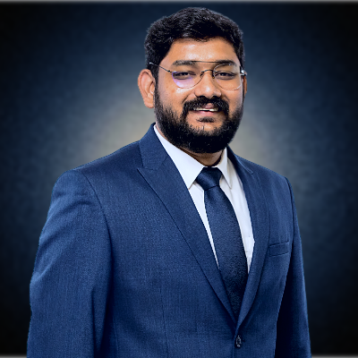 a man in a suit and tie with a beard