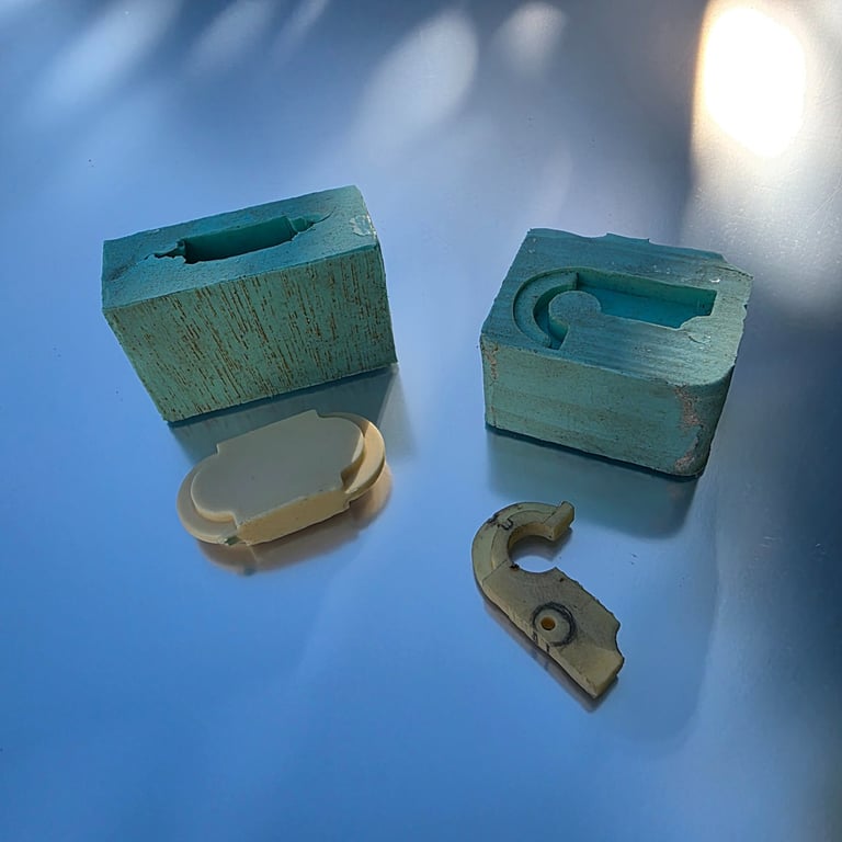 LaPenna lamp bracket fast-cast urethane with silicone mold and wood mock-up clasp