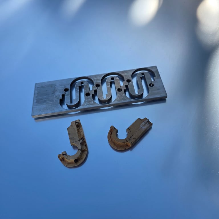 LaPenna lamp wood clasp mock-up with aluminum wire edm cut stock