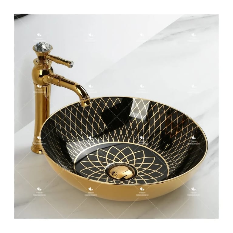 a bathroom sink with a gold sink and a faucet faucet