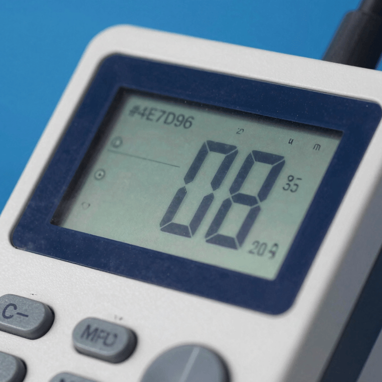 A perfectly painted slate blue (#1C3642) interior wall in a modern office, sharp edges and uniform texture.