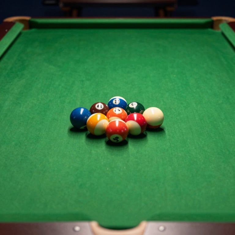 A polished billiards table with a set of balls arranged for a break, soft lighting reflecting off the dark forest green surface.