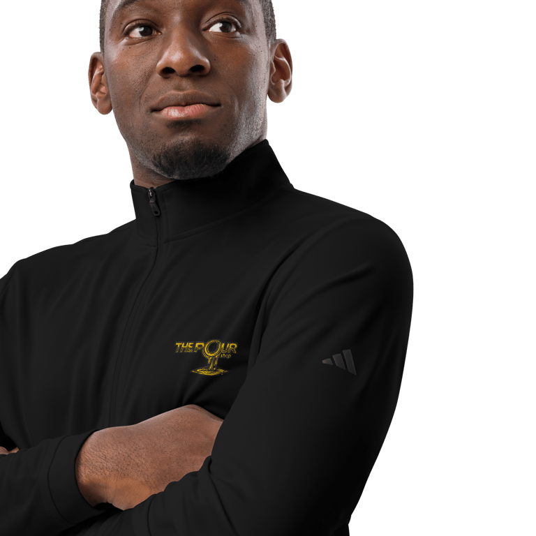 Person wearing adidas shirt with The Pour branding shown on chest in studio portrait