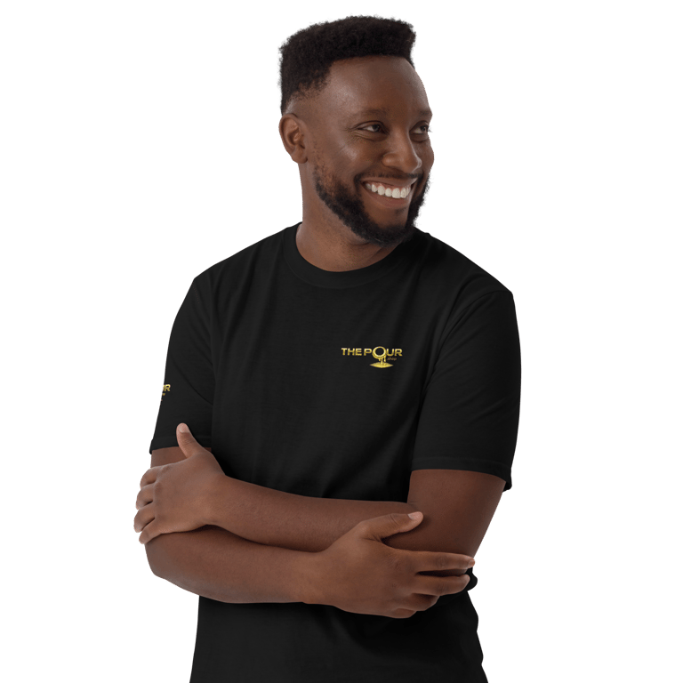 man wearing the pour shop logo black t shirt portrait