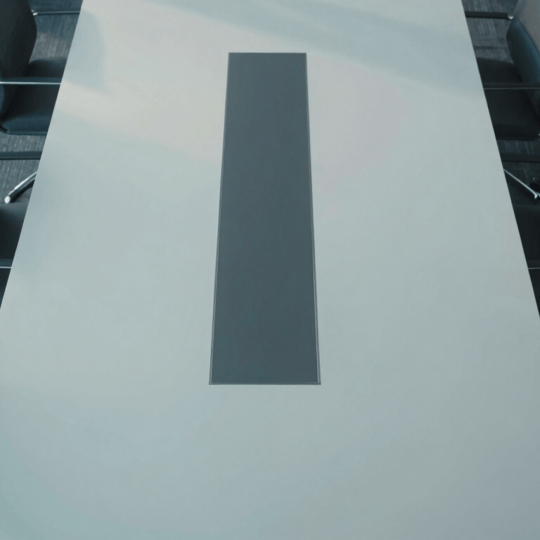 A wide shot of a North American / US financial center at night, with Dark Navy shadows and sharp Off-White light from high-rise windows.