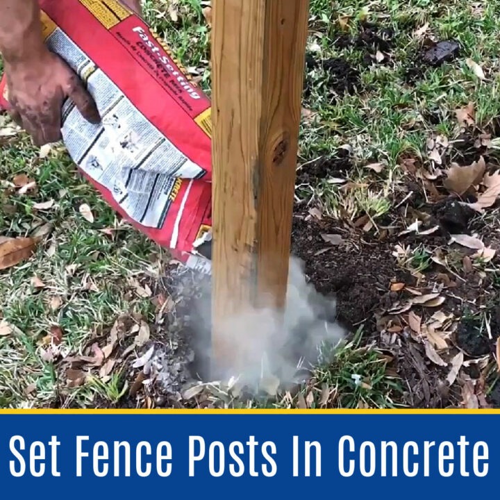 A person pouring fast-setting concrete mix from a bag into a hole to set a wooden fence post in the ground.
