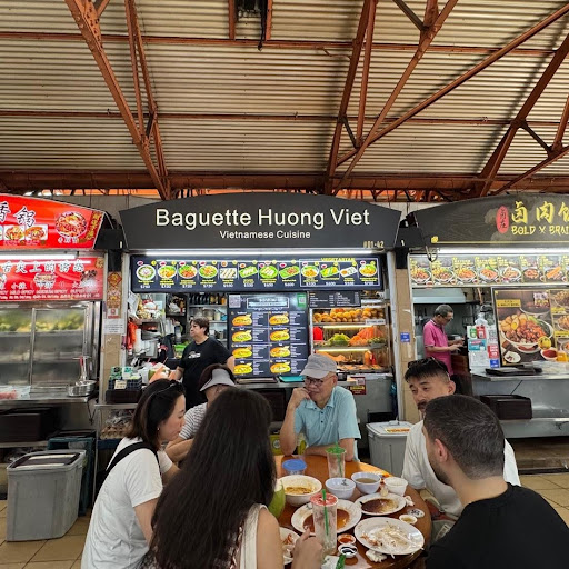 Locals enjoying custom Vietnamese Bánh Mì at Maxwell Food Centre (Photo: Khushi Nijhawan)