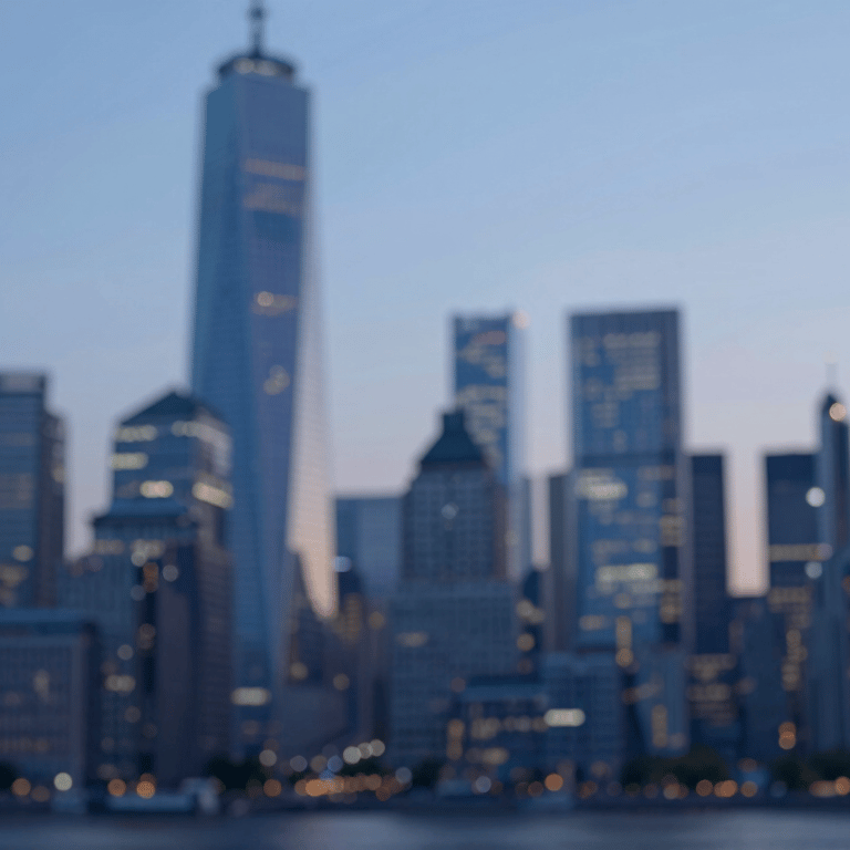 A diverse group of professional financial consultants collaborating in a modern glass-walled boardroom, focused on client success.