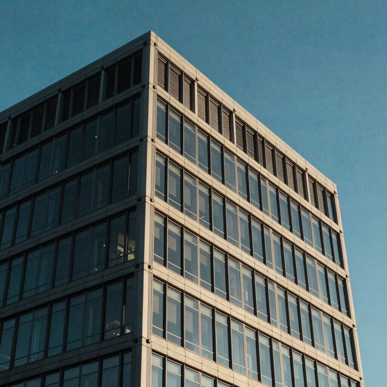 Modern architectural detail of an office building in Spokane, Washington, featuring glass and steel under a clear blue sky, North American / US style.