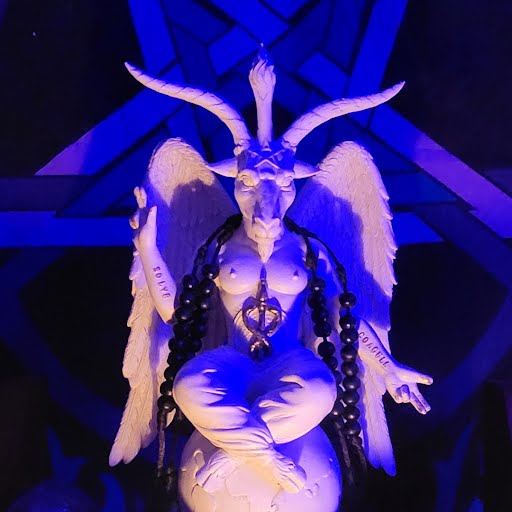 Baphomet statue with wings and horns under blue light for occult ritual or altar display.