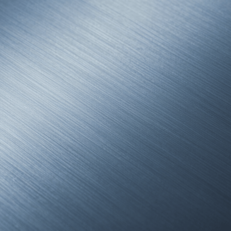 A heavy-duty CNC milling machine in a clean factory setting, featuring industrial blue details and bright overhead lighting.