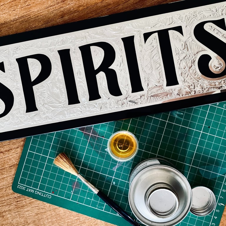 chipped glass spirits bar sign with 12ct white gold
