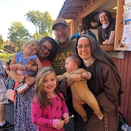 A family receiving help from the Rose Garden Mission