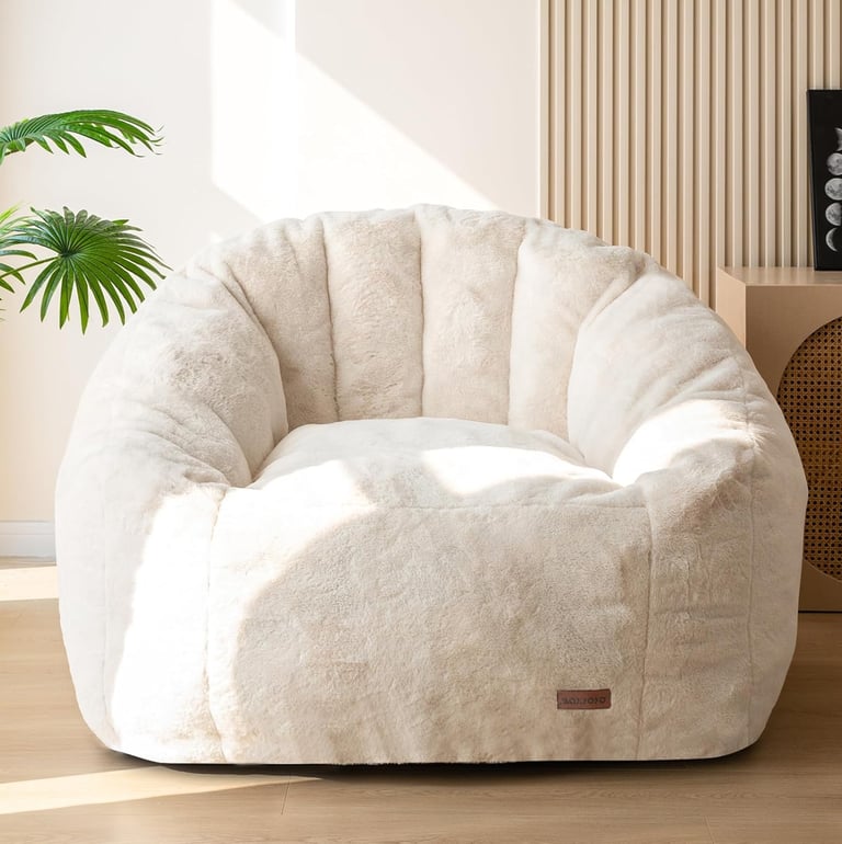Oversized faux fur cozy reading chair in a neutral beige living room
