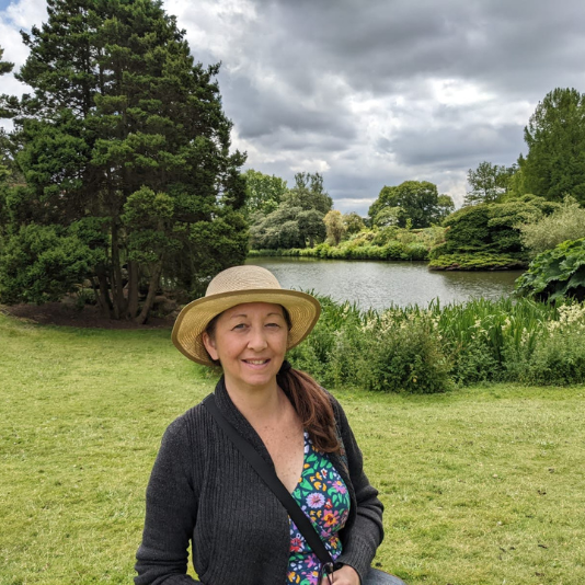 Artist standing by a lake in England