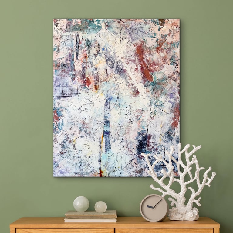 Imagine an abstract painting in  blues and oranges against a sage green wall.