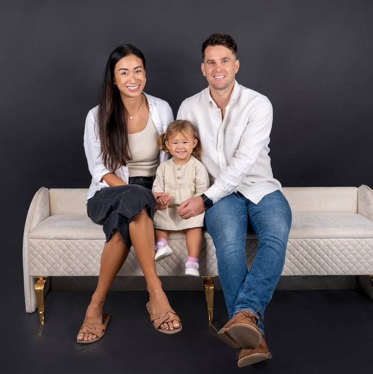 Tender family embrace captured in a timeless portrait, celebrating love and togetherness.