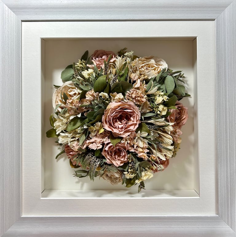 Birdseye view preserved wedding bouquet in a thick white frame
