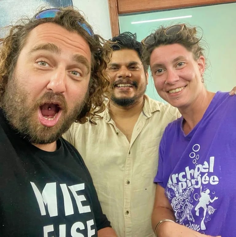 About us page shows a fun image of tattoo artist Raja Natraj in the tattoo studio with his clients. 