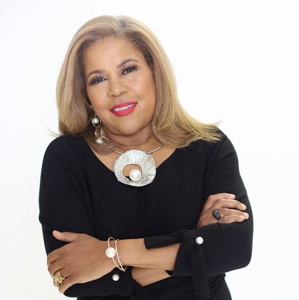 Sybil Wilkes stylish in black with modern accent accessories.