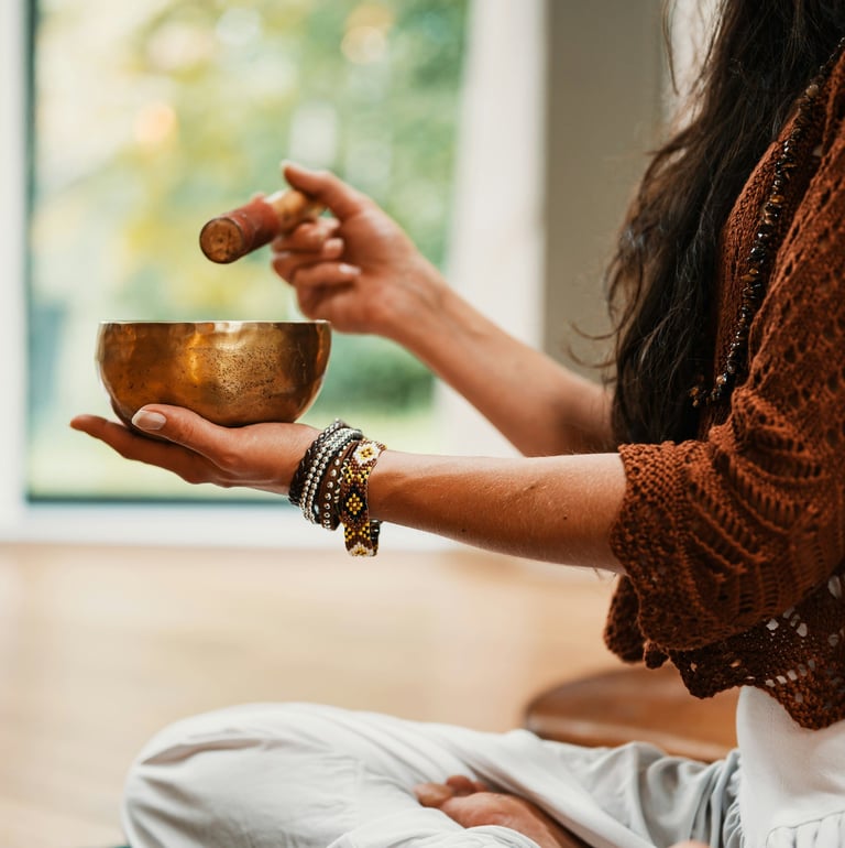 woman in brown knit sweater holding brown ceramic bowl