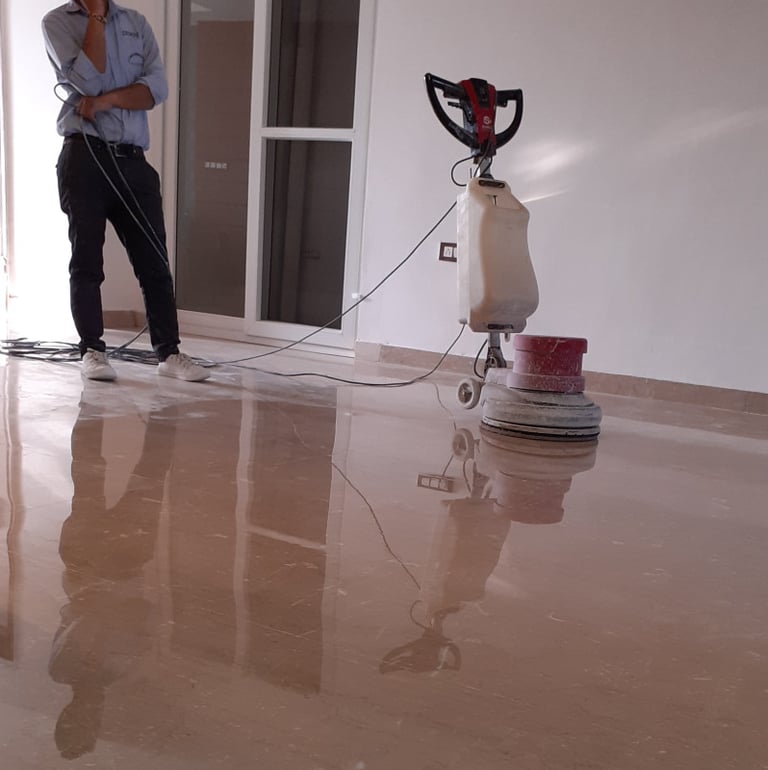 Polishing a marble floor for a high reflective shine to finish.