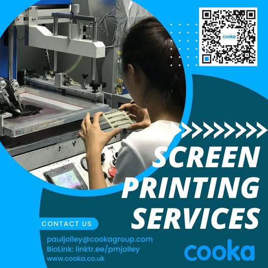 a woman is looking at a screen printing on a computer